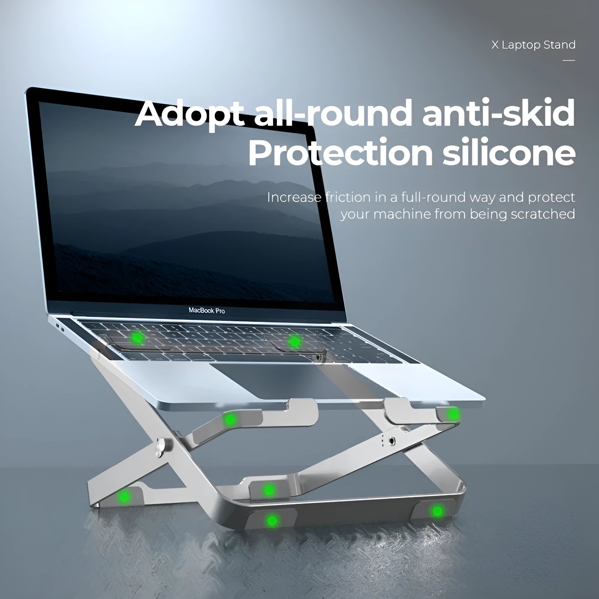 Folding silver grey aluminium laptop stand with silicone pads in expanded position showing heat dissipation design