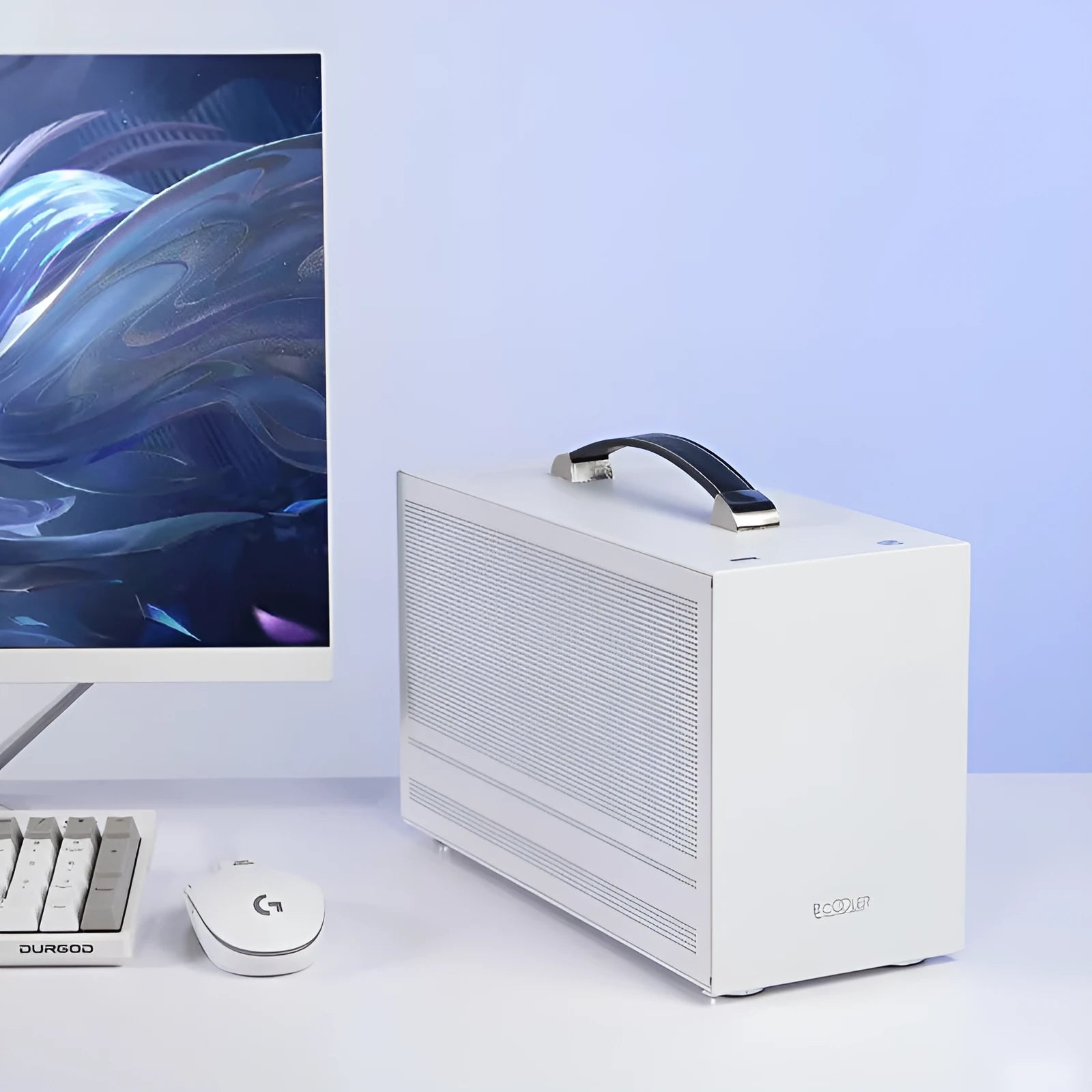 Three Hummingbird Mini ITX desktop computer case in titanium gray, showing compact form and front panel.