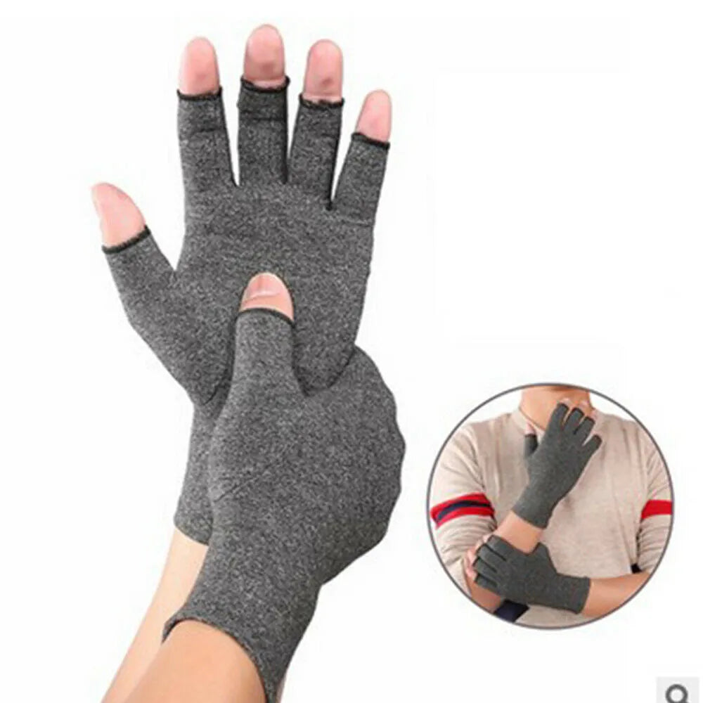 Grey half-finger joint compression gloves with anti-slip palm on a flat surface.