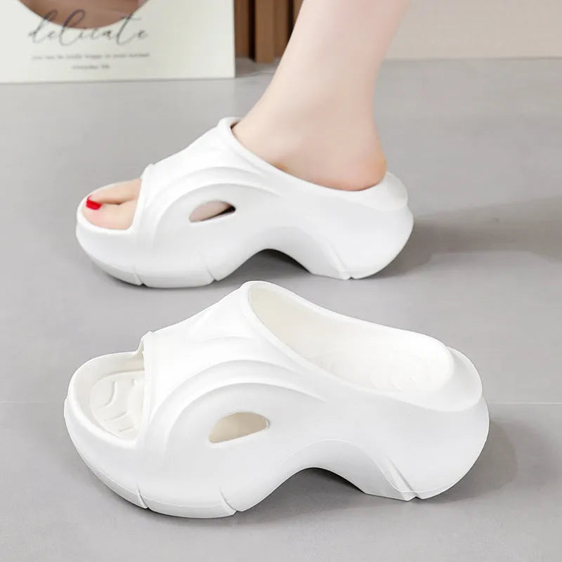 Women's thick-soled EVA slippers in white, black, or rose red colours with rounded toe design