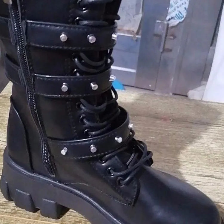 Black women's mid-calf knight boots with a metal buckle and side zip on a white background.