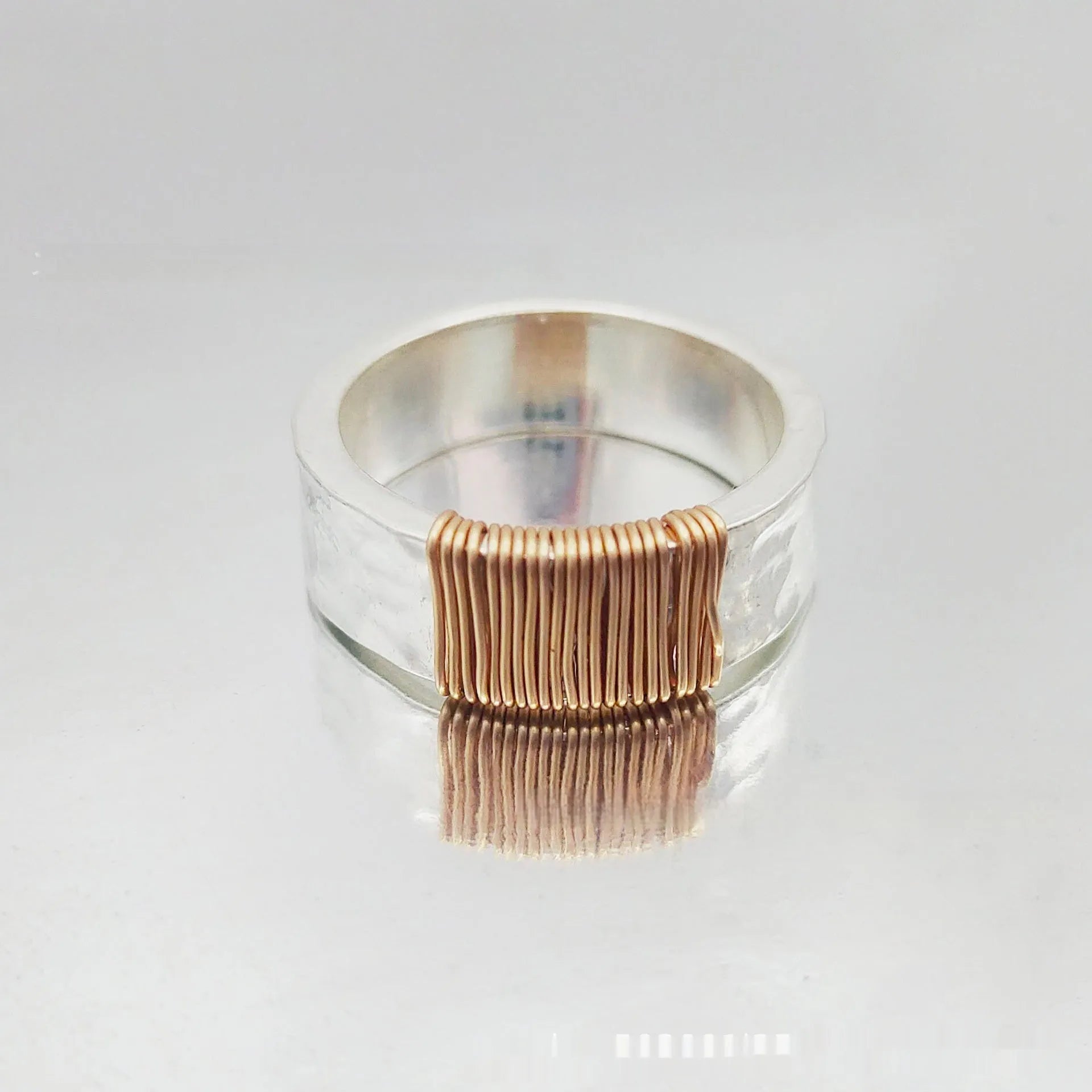 Copper geometric ring with silver golden electroplated finish and irregular vintage coil design.