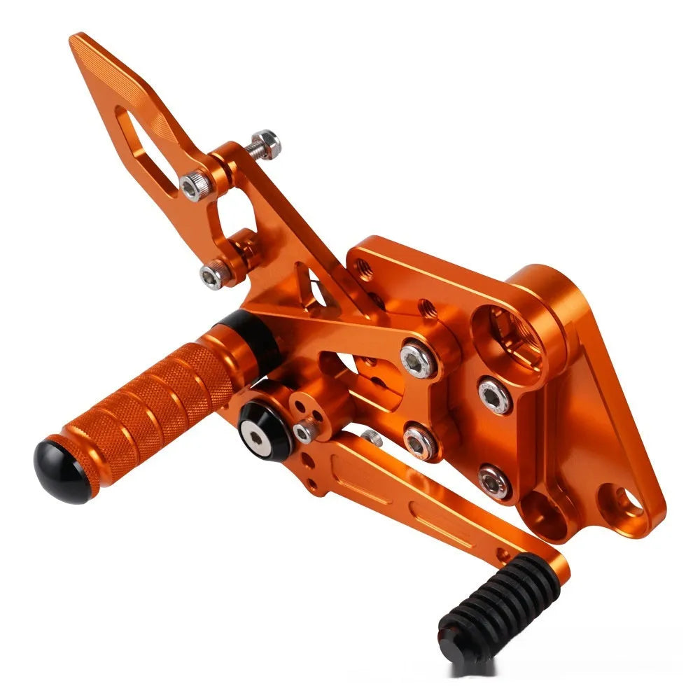 Black and orange KTM DUKE motorcycle footpeg bracket assembly for 125 200 250 390 models