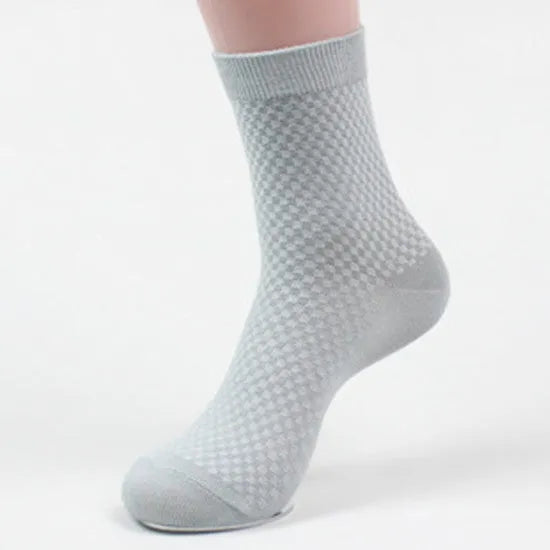 Pack of five men's bamboo fibre ankle socks in different colours, showing small square pattern.