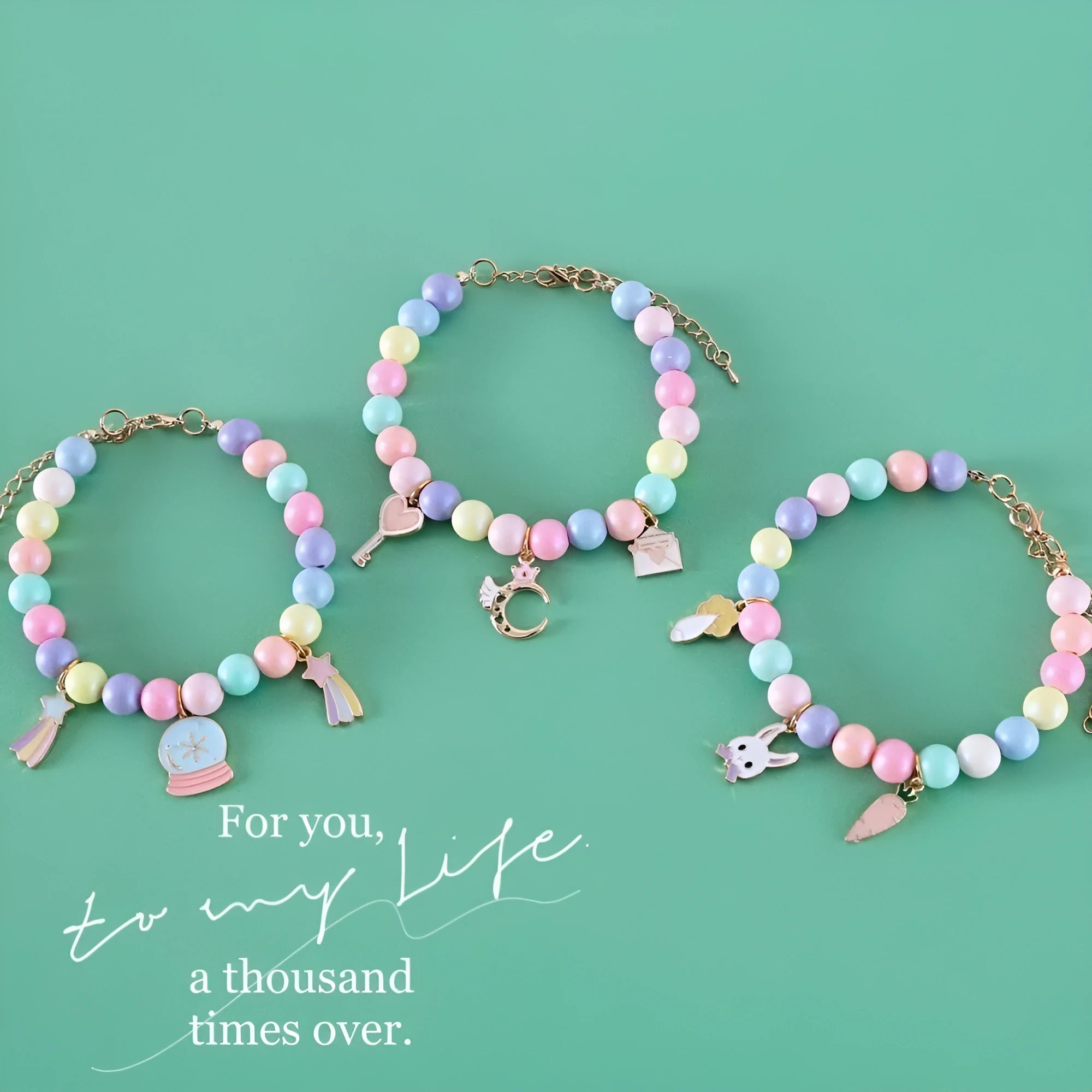 Macaron-coloured dog collar and bracelet set with resin moon, meteor, and rabbit charms in three sizes.