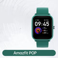 Smart watch with colour screen and green silicone strap on wrist, showing fitness data.