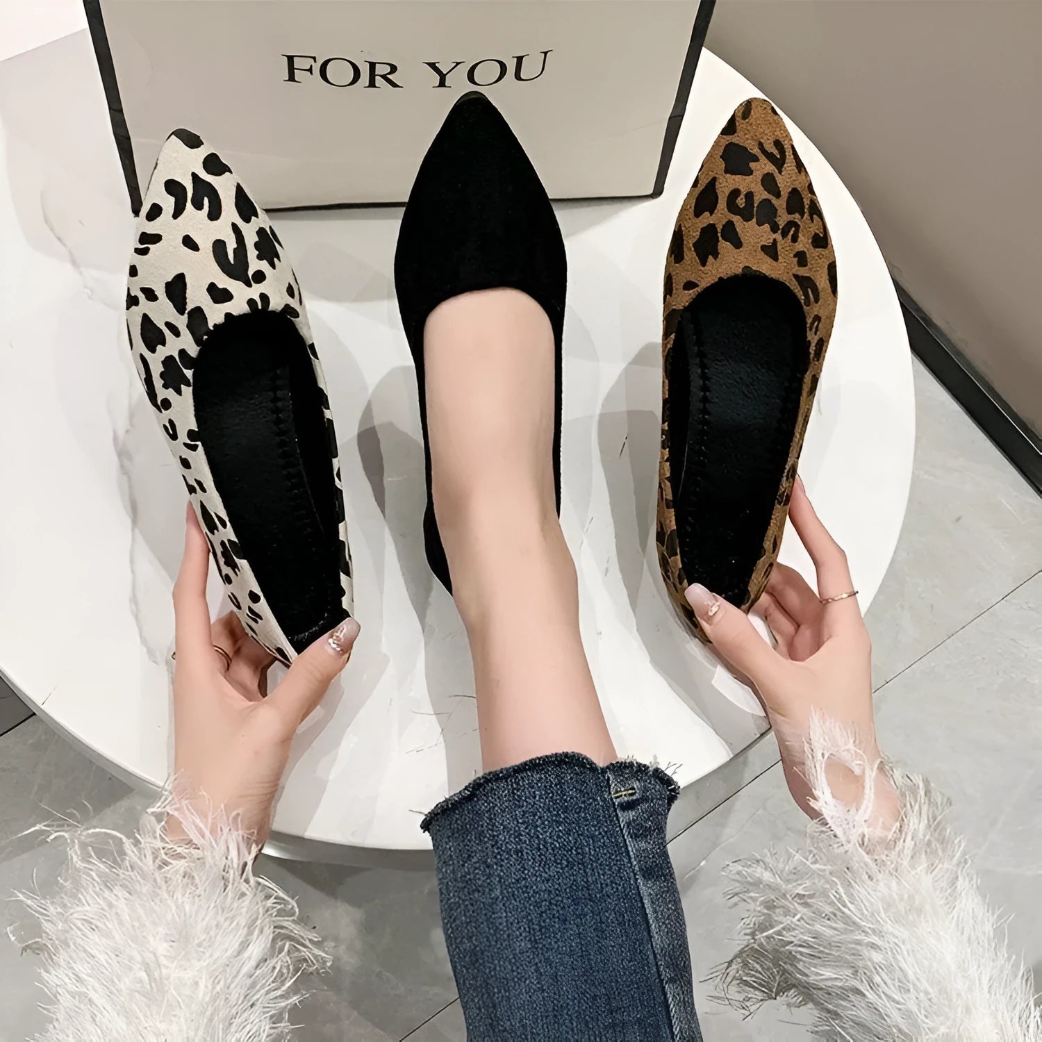 Leopard print women's flat pumps with pointed toe and low heel on rubber sole