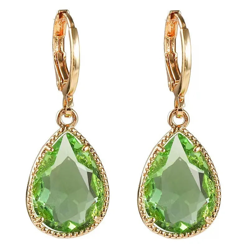 Hand-carved glass water drop earrings with geometric Saturn pendant in copper tone with colourful glass options