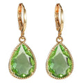 Hand-carved glass water drop earrings with geometric Saturn pendant in copper tone with colourful glass options