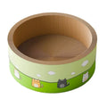 A large round corrugated cardboard cat scratch board with a deep, textured pit design on a wooden floor.