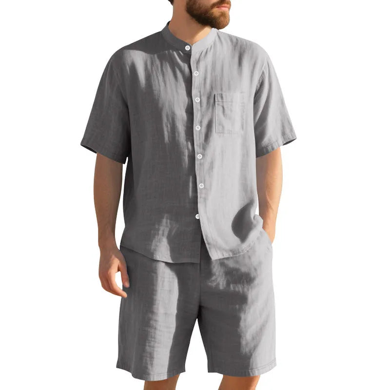 Men's light blue linen blend summer suit with short sleeves and shorts on a hanger.