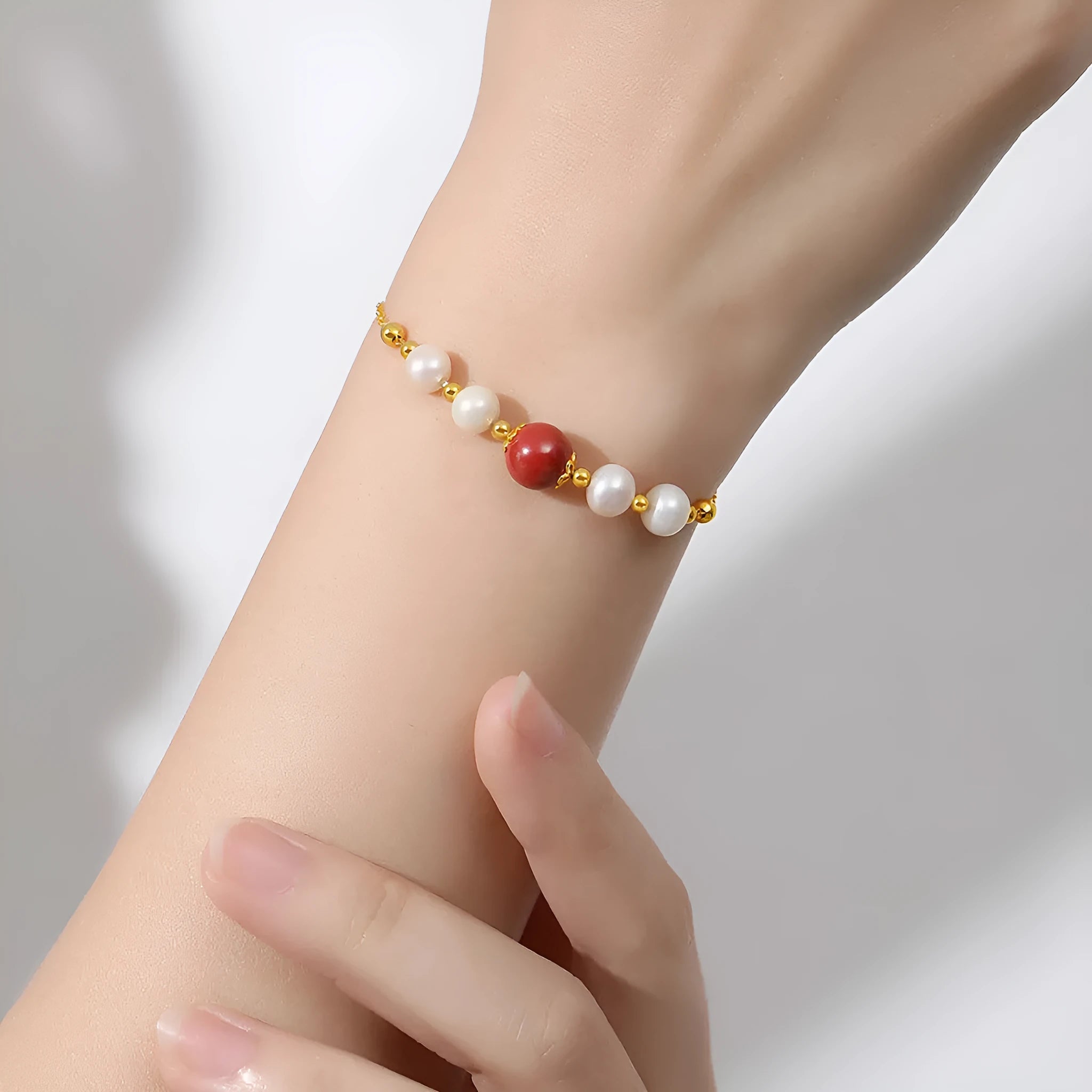 Yellow-finished 925 silver bracelet with red bean and pearl beads in retro style for women
