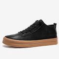 Men's black leather casual shoes with a round toe, flat heel, and lace-up closure on a rubber sole.