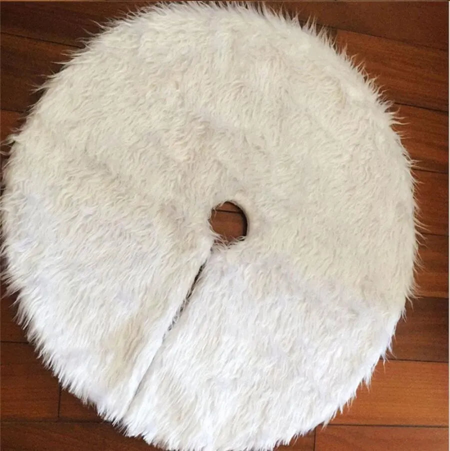 White plush Christmas tree skirt placed around base of decorated Christmas tree, 122cm size
