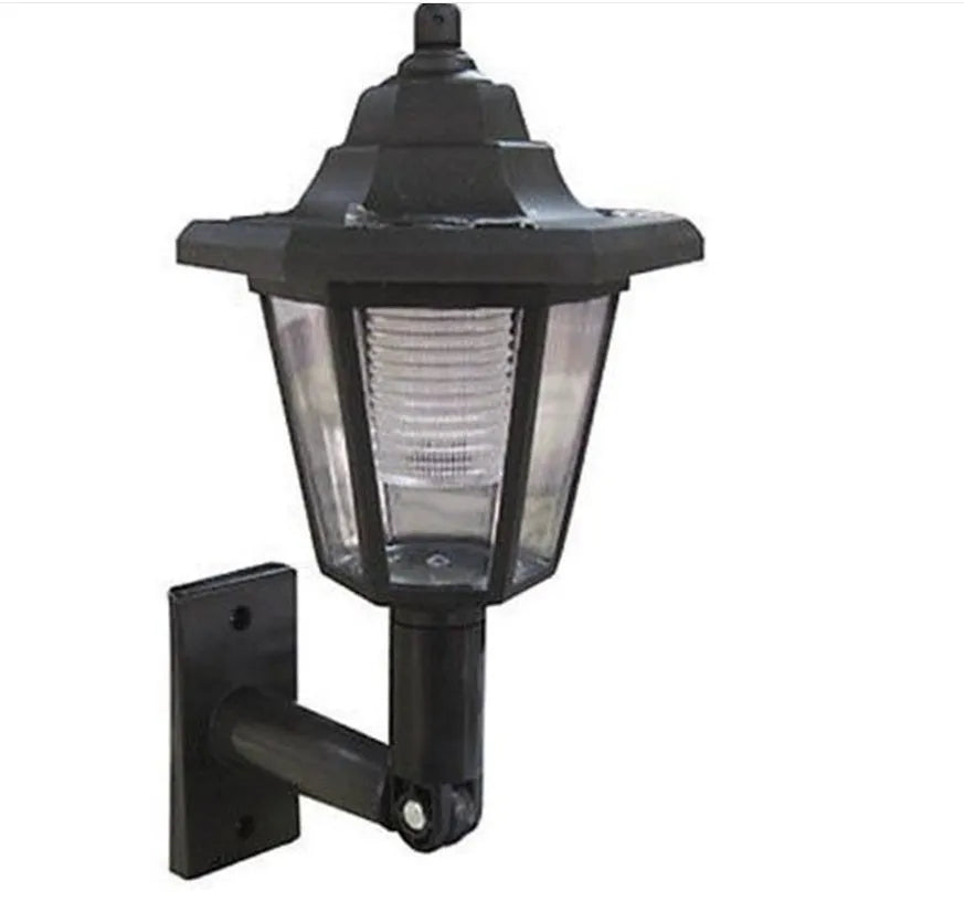 Black hexagonal solar-powered wall lamp for outdoor garden use.