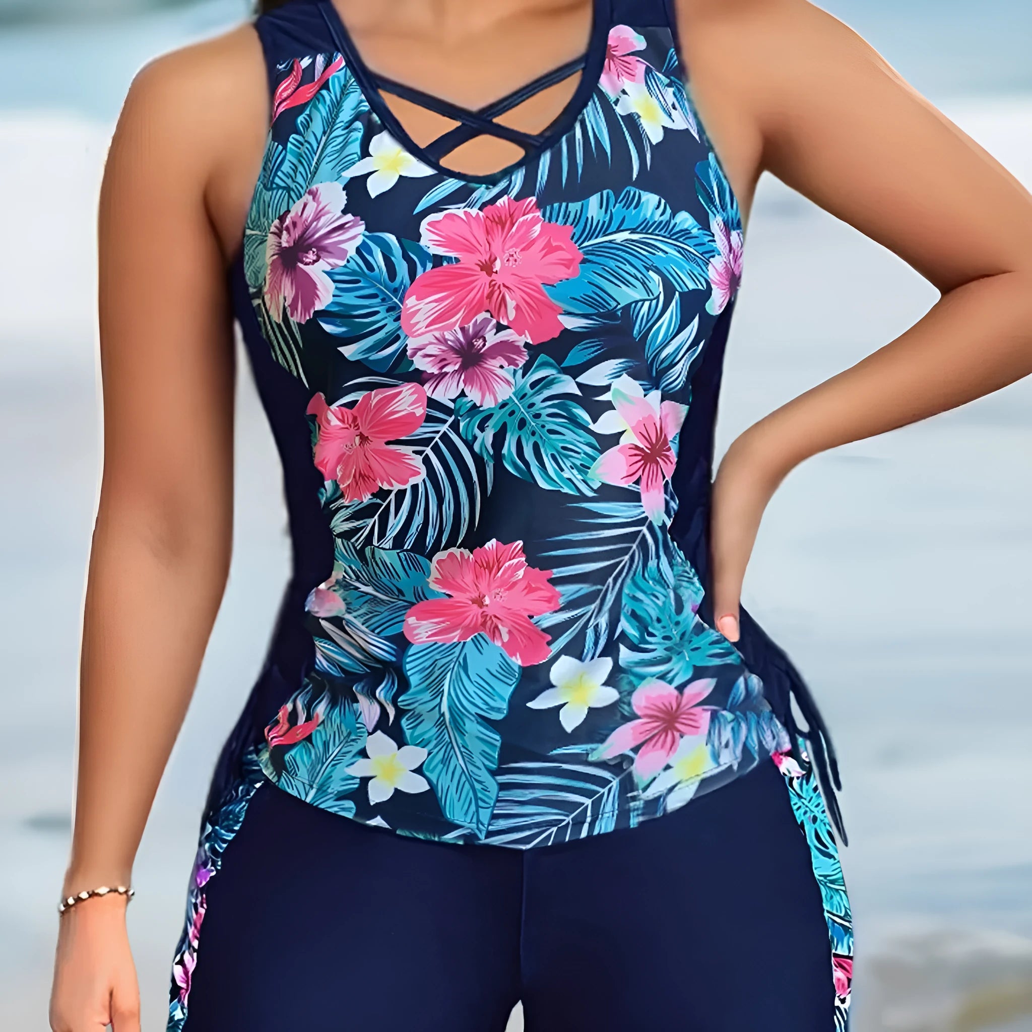 Women's plus size floral high-waist swim bikini in blue on a neutral background.