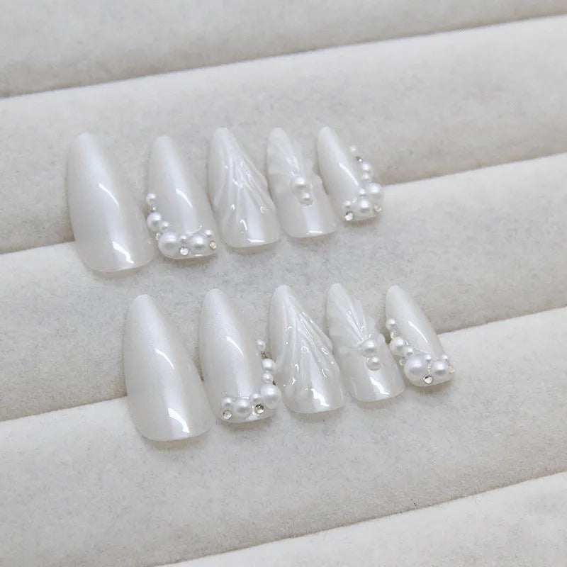 24 pieces of white press-on artificial nail tips with diamond sparkle finish in a pack