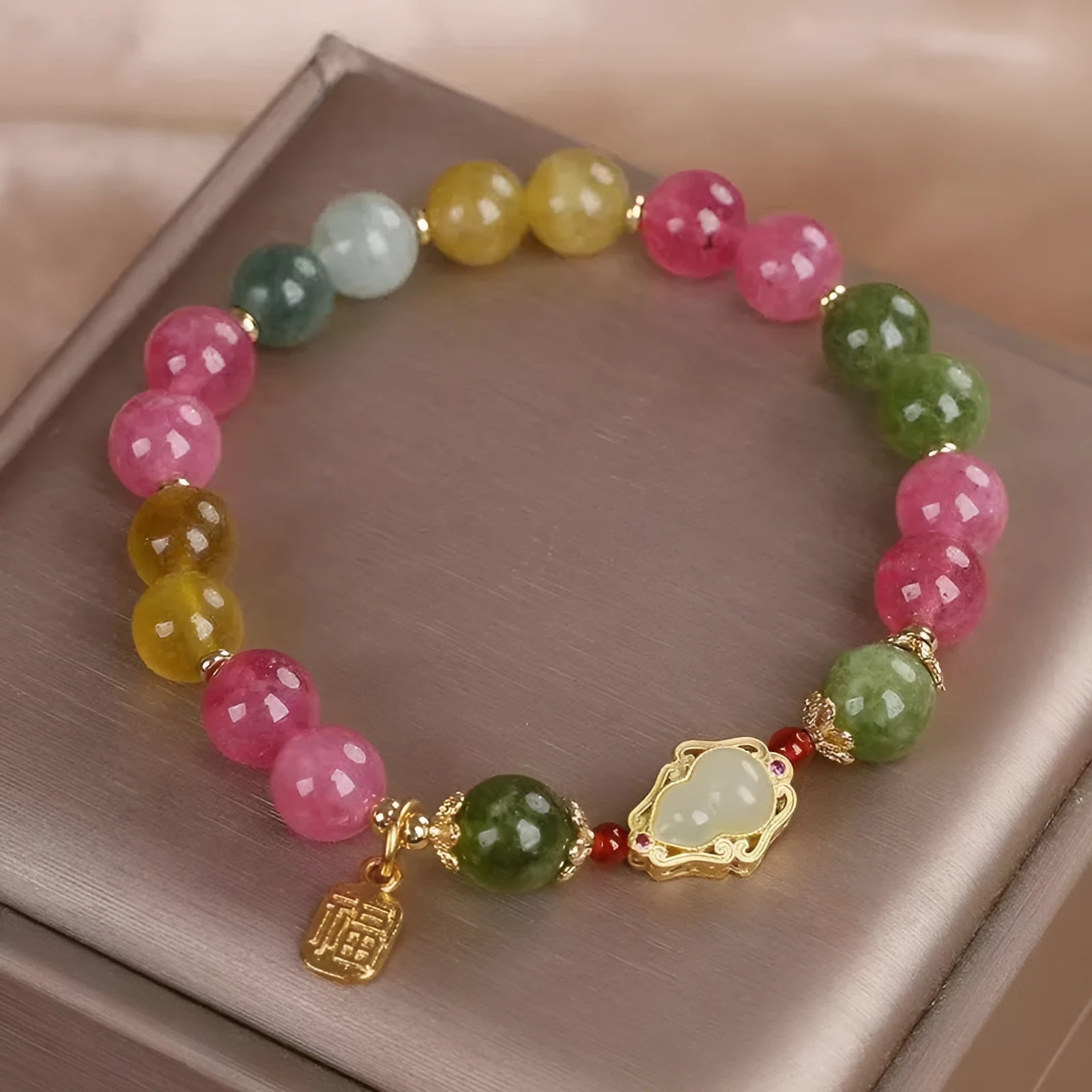Women's bracelet with colourful tourmaline beads and electroplated gourd blessing card and flower charms