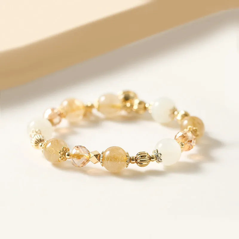 Gold tone rutilated quartz crystal bracelet with electroplated finish and Korean style design