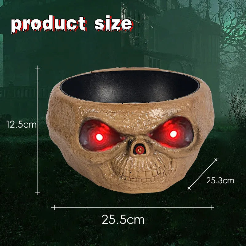 Plastic Halloween pumpkin candy bowl with motion-activated skeleton hand and lighted red eyes