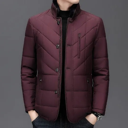 Men's dark blue padded winter short coat with side pockets on a neutral background.