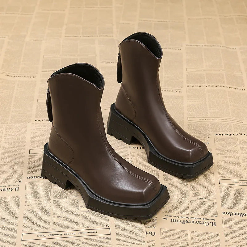 Black square toe platform Martin boots for women with a back zipper and a mid-calf height.