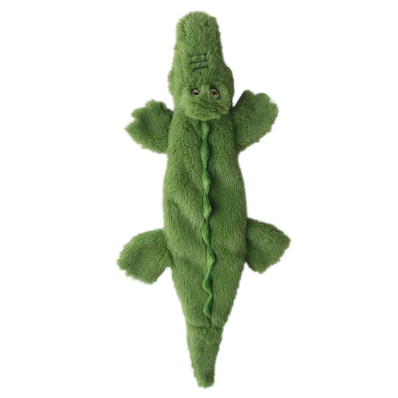 Green crocodile plush dog toy with squeaker and crinkle paper tail for aggressive chewers