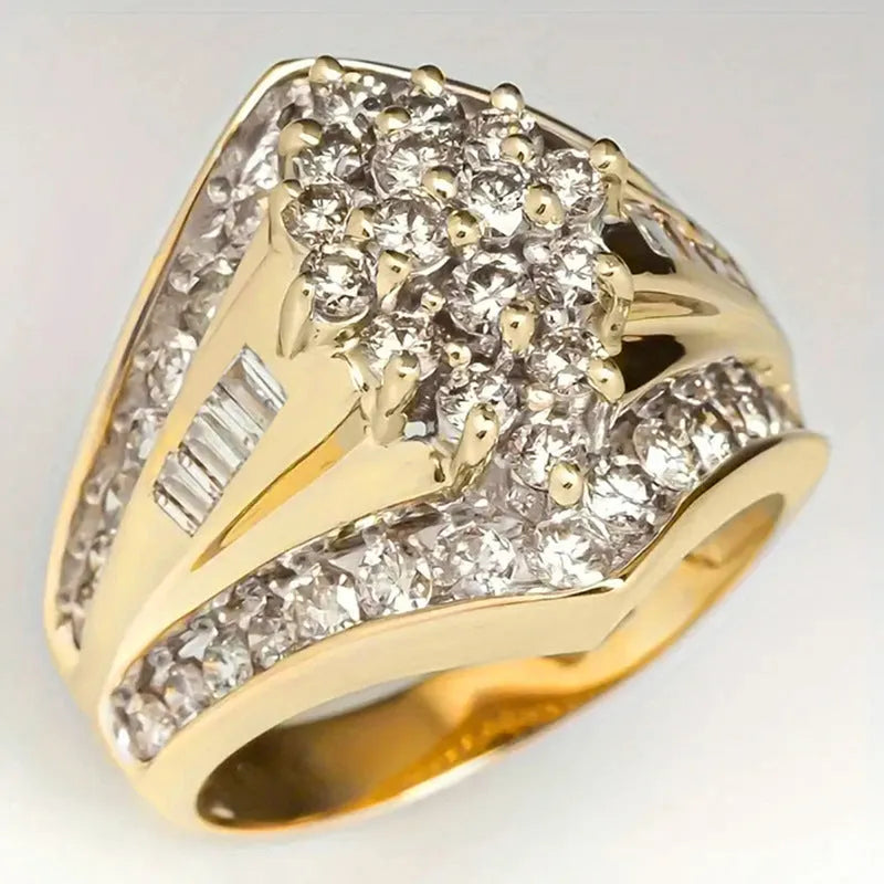 Geometric gold-coloured copper palace style ring on a plain background.