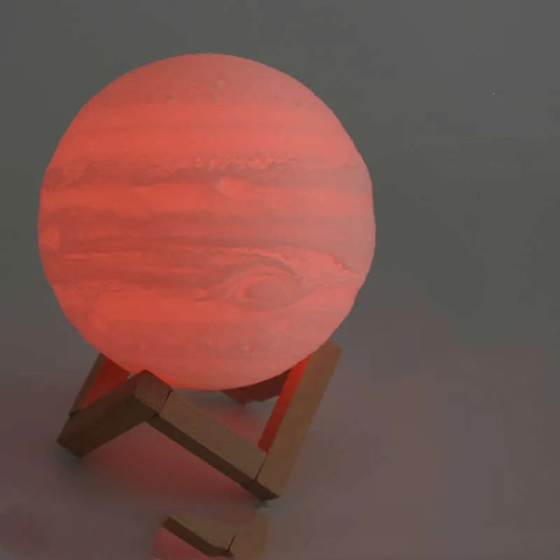 3D printed white moon lamp with detailed craters on a wooden holder, showing touch ring at base.