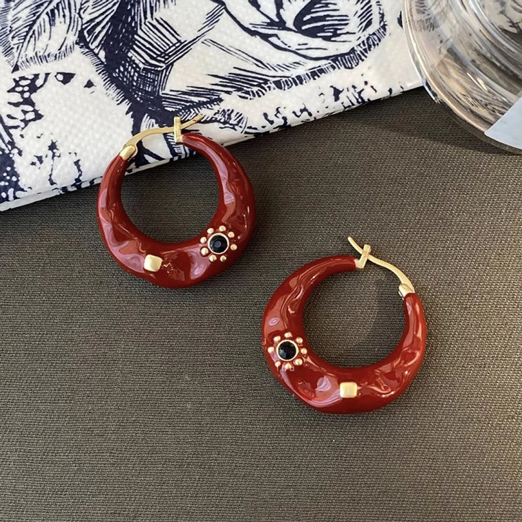 Hong Kong style retro stud earrings with dripping oil finish and rhinestone accents in black and red colours