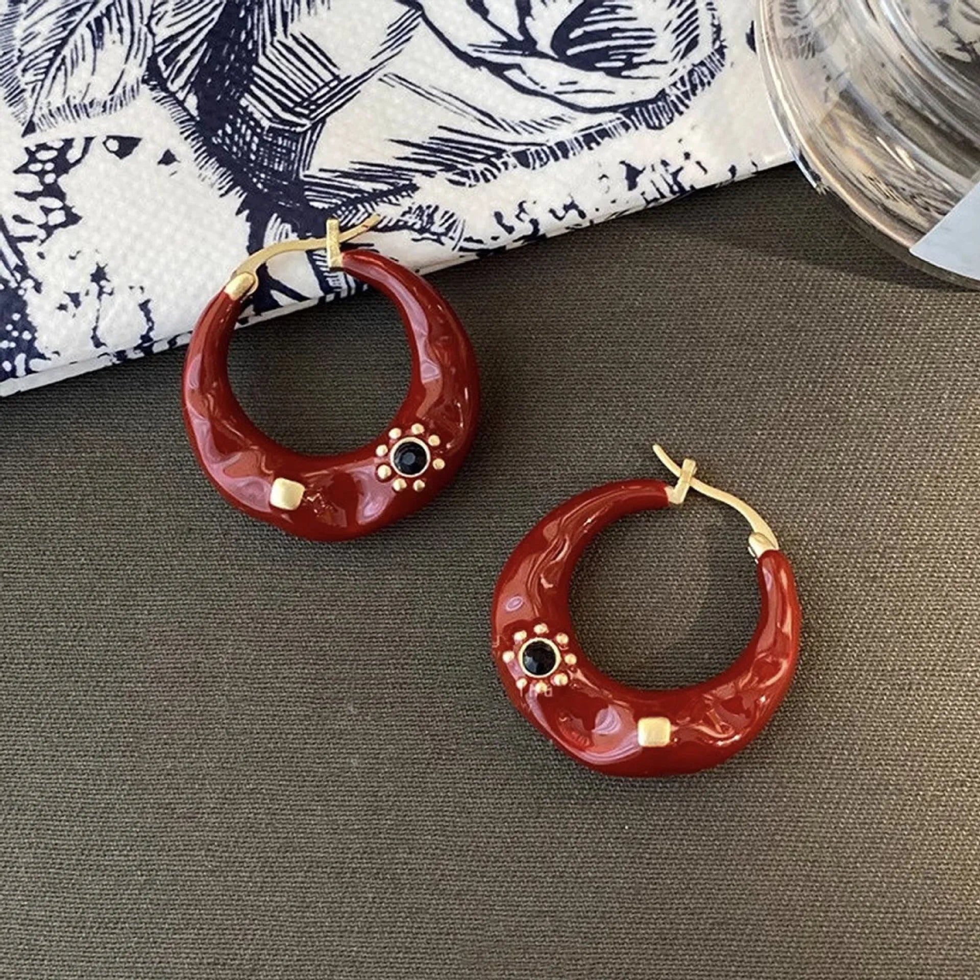 Hong Kong style retro stud earrings with dripping oil finish and rhinestone accents in black and red colours