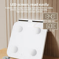 White smart body fat scale with 8 silver electrodes and LED display on tempered glass.