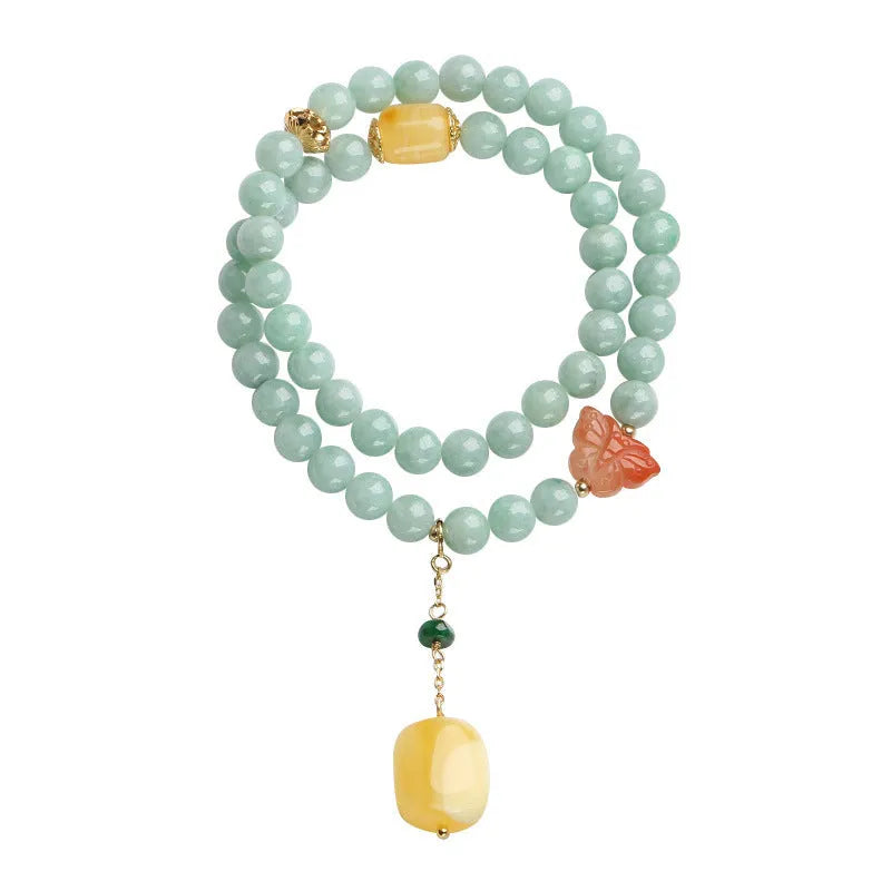 Close-up of a double-layer women's bracelet with green jade round beads and honey-coloured beeswax barrel beads.