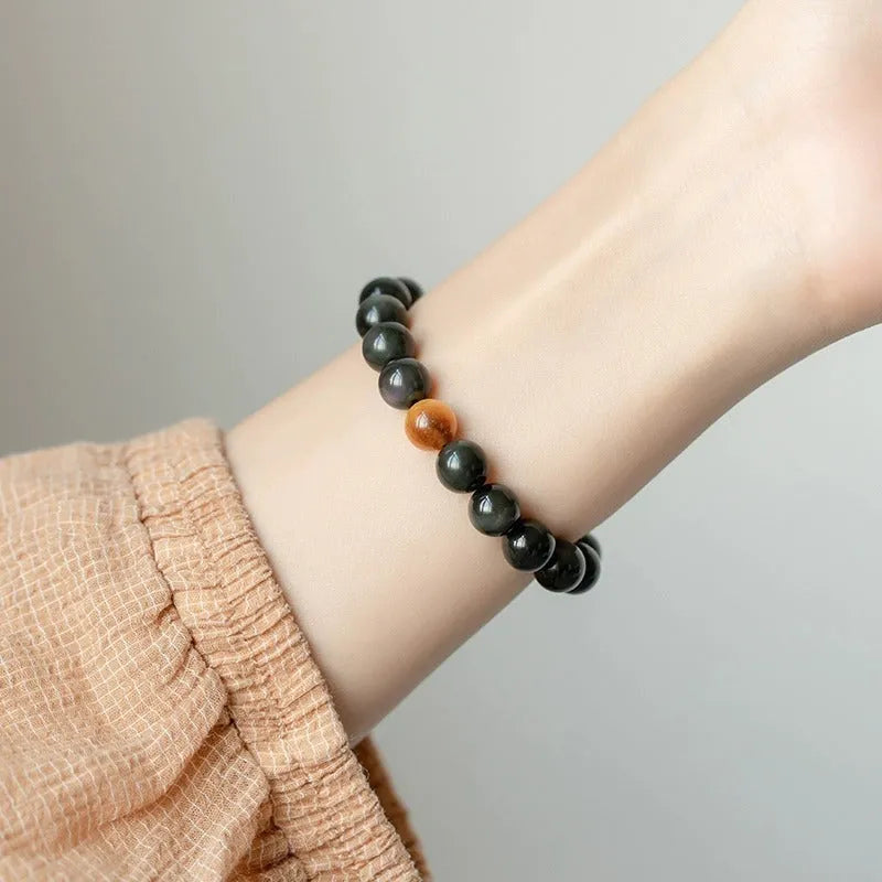 Black obsidian stone bracelet with geometric beads in Korean unisex style.