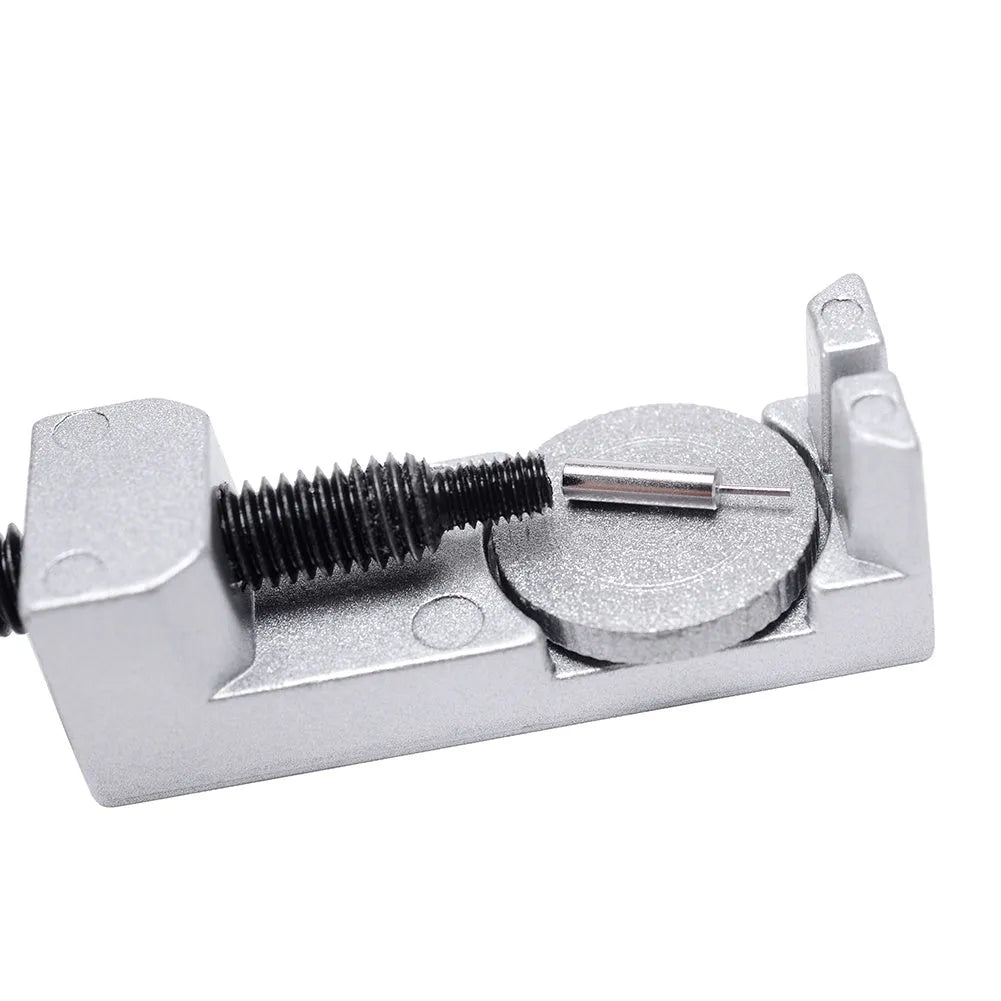 Silver metal watch strap adjuster tool with three spare needles for resizing steel bracelets