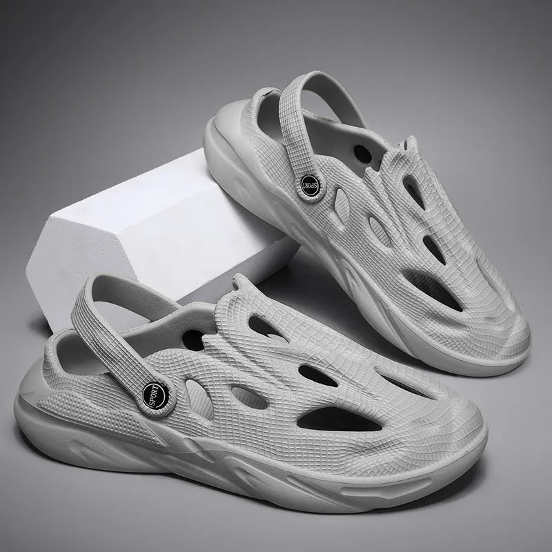 Men's breathable hollow-out EVA slippers in grey, flat heel, round toe, on a plain background