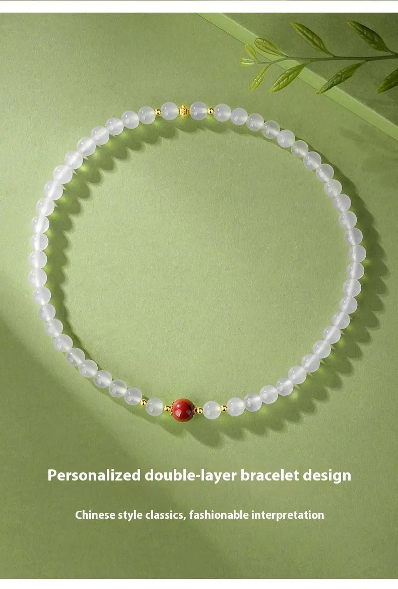 White agate women's bracelet with geometric design and Jequirity Bean Cinnabar detailing