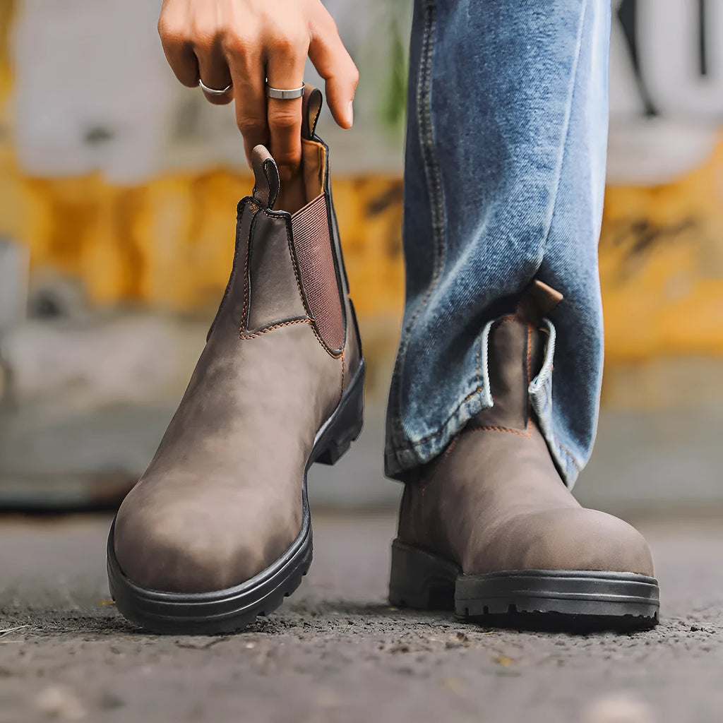 Chelsea boots with artificial PU upper, rubber sole, wedge heel, in solid colour black – side view for unisex winter wear