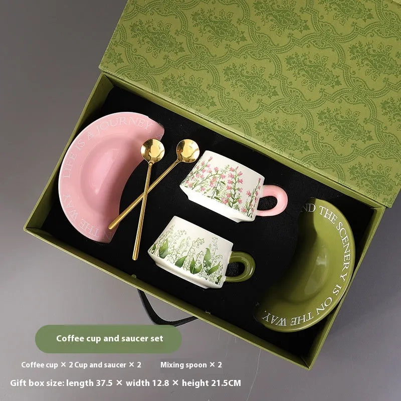 Ceramic coffee cup and saucer set with two mugs, two saucers and two stirring spoons