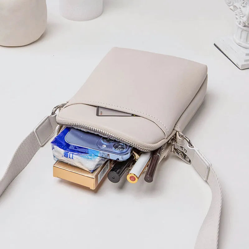 Small solid colour crossbody shoulder bag for mobile phones in beige.