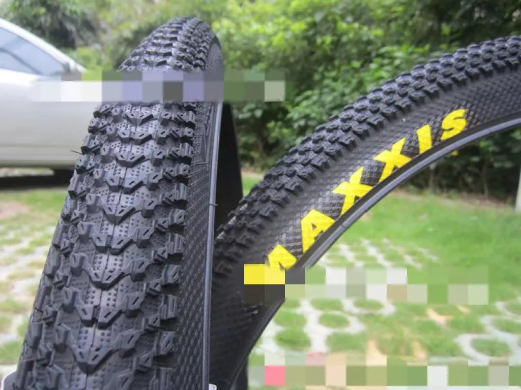 Ultralight puncture proof mountain bike tyre shown in 26, 27.5, and 29 inch sizes with black and white label sidewall options.