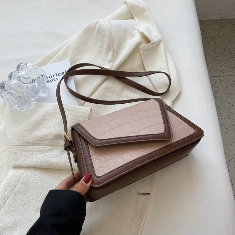 Women's square shoulder bag in PU leather with urban simplicity style showing horizontal shape