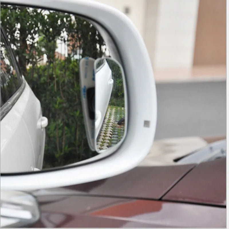 Glass adjustable blind spot mirror with angle adjustment bracket for car rearview mounting.