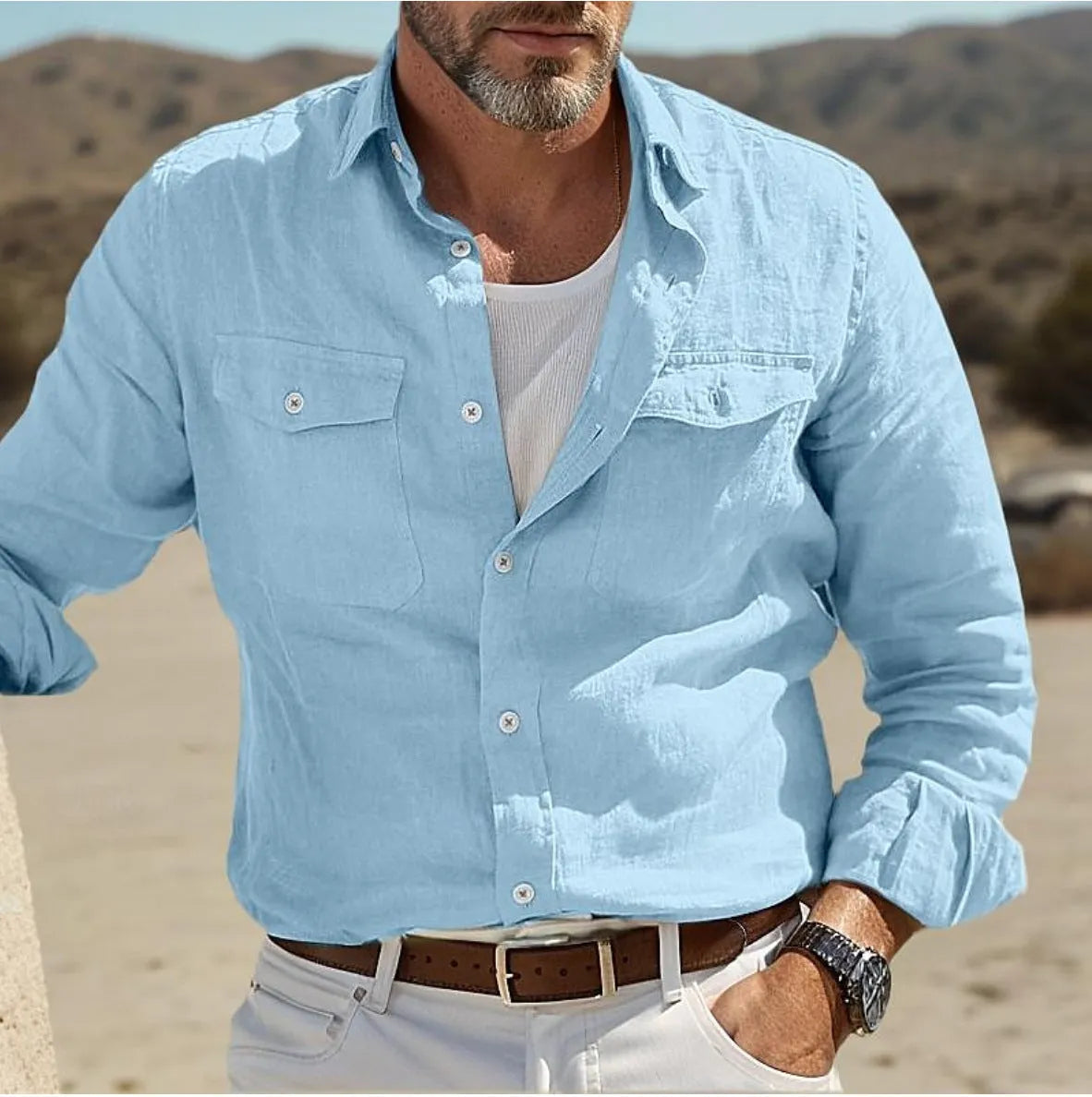 Men's loose fit long-sleeved shirt in cotton linen blend, shown in solid green colour.