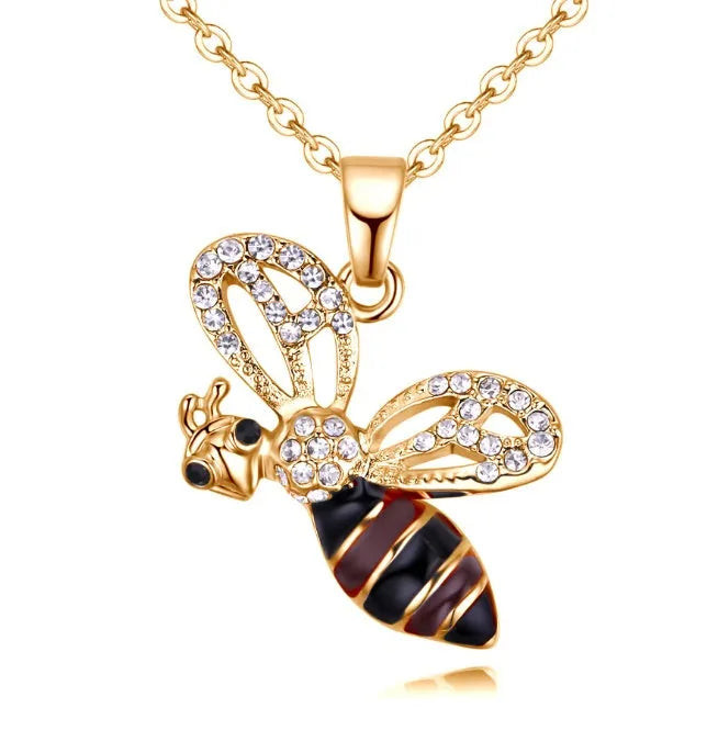Cartoon bee drop pendant necklace with oil studded alloy finish on cross chain, yellow colour option, on white background