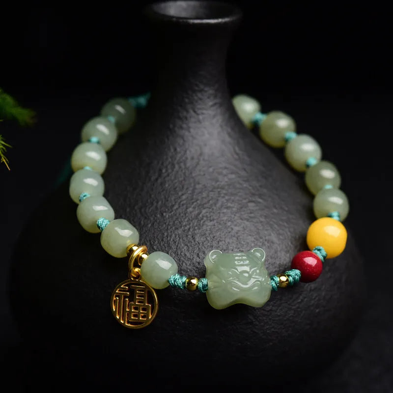 Natural Hetian jade and cinnabar beeswax bead bracelet with animal zodiac design, bead size 5x7mm.