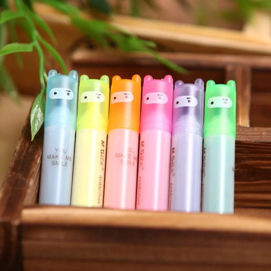 Six highlighter pens with slanted oblique shape in plastic casing showing different colours