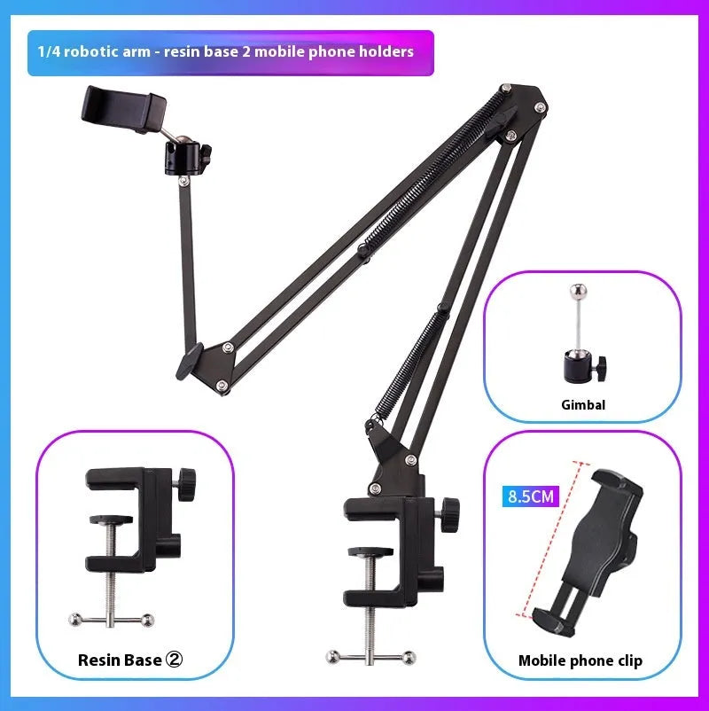 Black foldable metal cantilever bracket holding a tablet on a desktop, showing adjustable arms and clip.