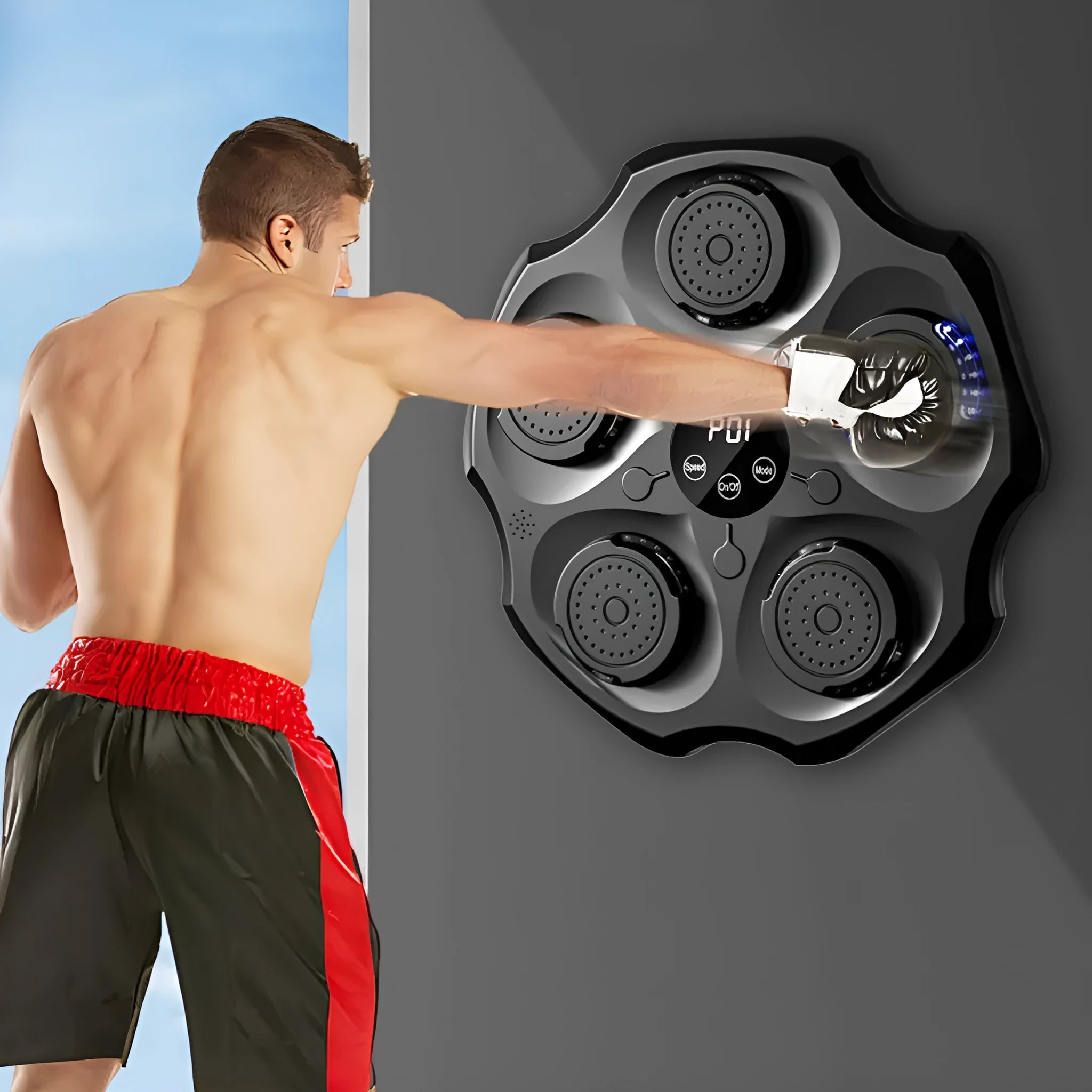 Black hanging-style Bluetooth music boxing wall target with a red boxing glove.