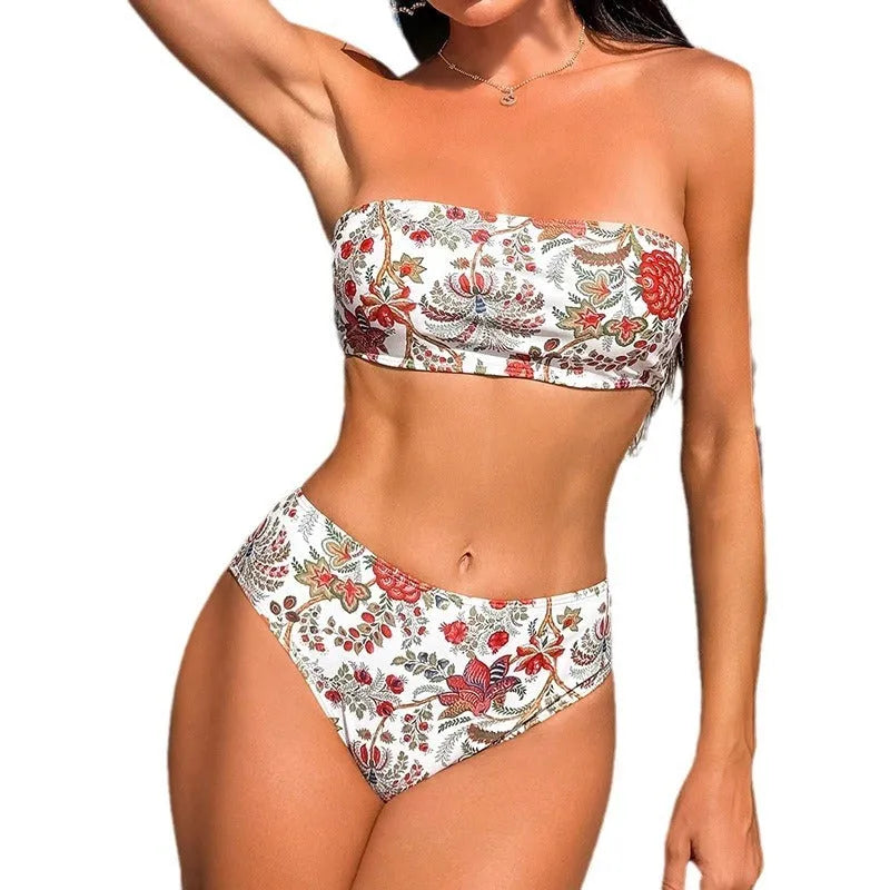 Close-up view of a women's printed bandeau swimsuit top and high-waisted shorts set laid flat.